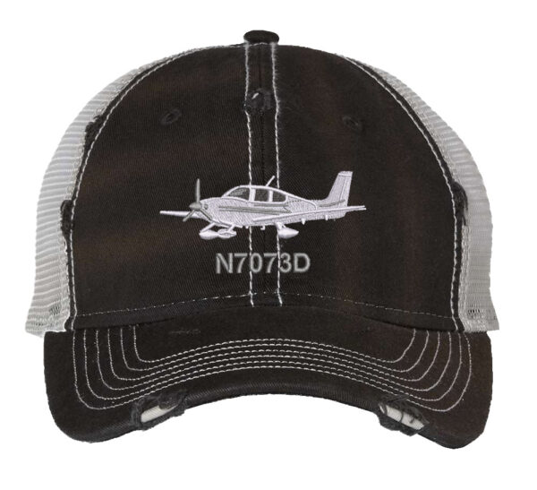 Distressed trucker hat featuring an embroidered Cirrus airplane with custom tail number, perfect for aviation enthusiasts and aircraft owners, adding aviation flair to your wardrobe.