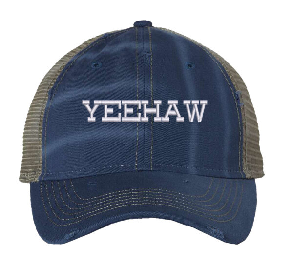 Image shows a distressed trucker hat with "Yeehaw" embroidered on the front. The hat features a mesh back and snapback closure.