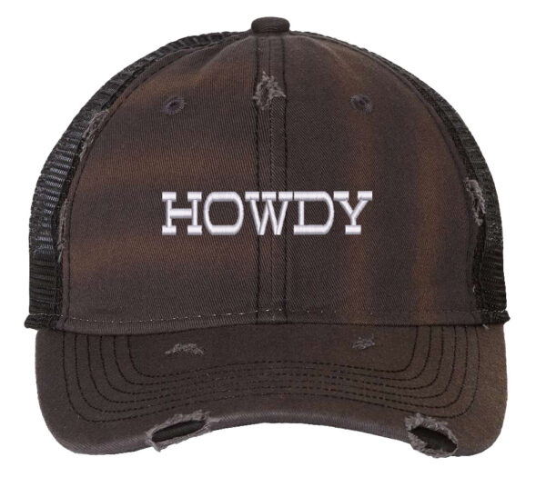 Image shows a distressed trucker hat with the word "Howdy" embroidered on the front. The hat features a mesh back and snapback closure.