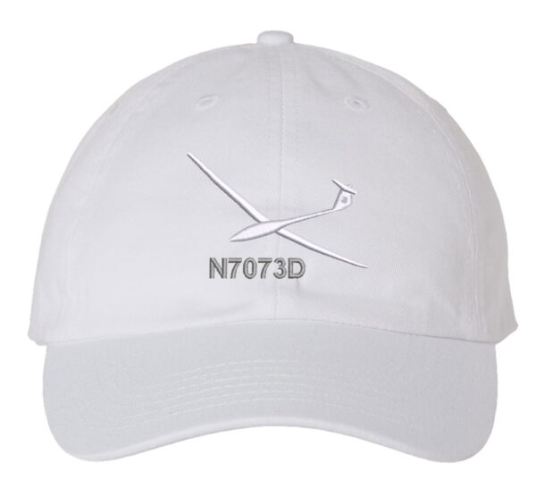 Image shows a baseball cap with an embroidered glider aircraft design and custom tail number.