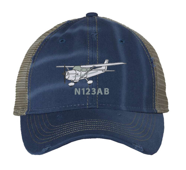Distressed trucker hat featuring an embroidered Cessna airplane with custom tail number, ideal for aviation enthusiasts and aircraft owners, adding aviation flair to your wardrobe.