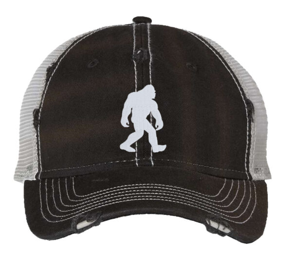 Distressed trucker hat featuring an embroidered Bigfoot silhouette, ideal for outdoors enthusiasts, adding mystery and style to your outdoor wardrobe.